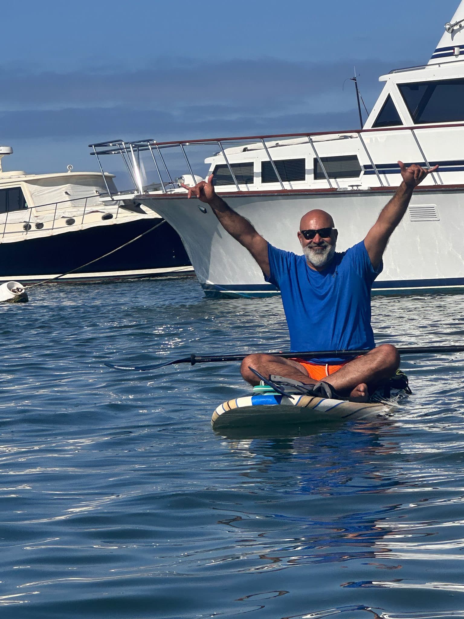 Parham Shariat paddleboarding near Newport Beach, California